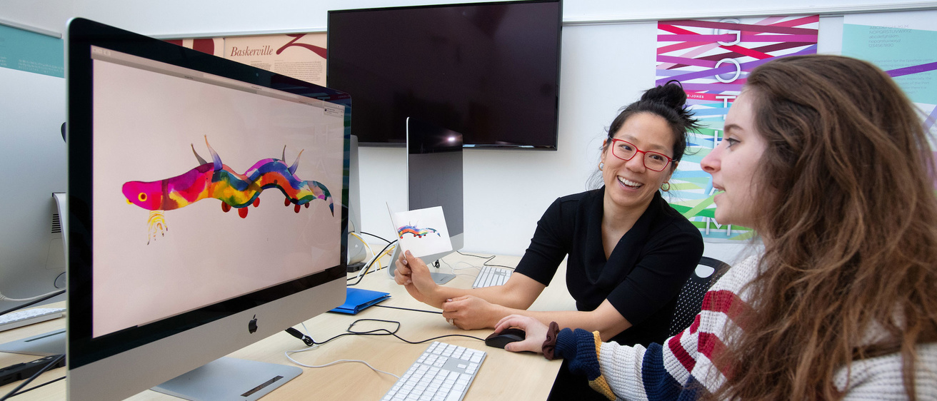 mentor and student working at computer
